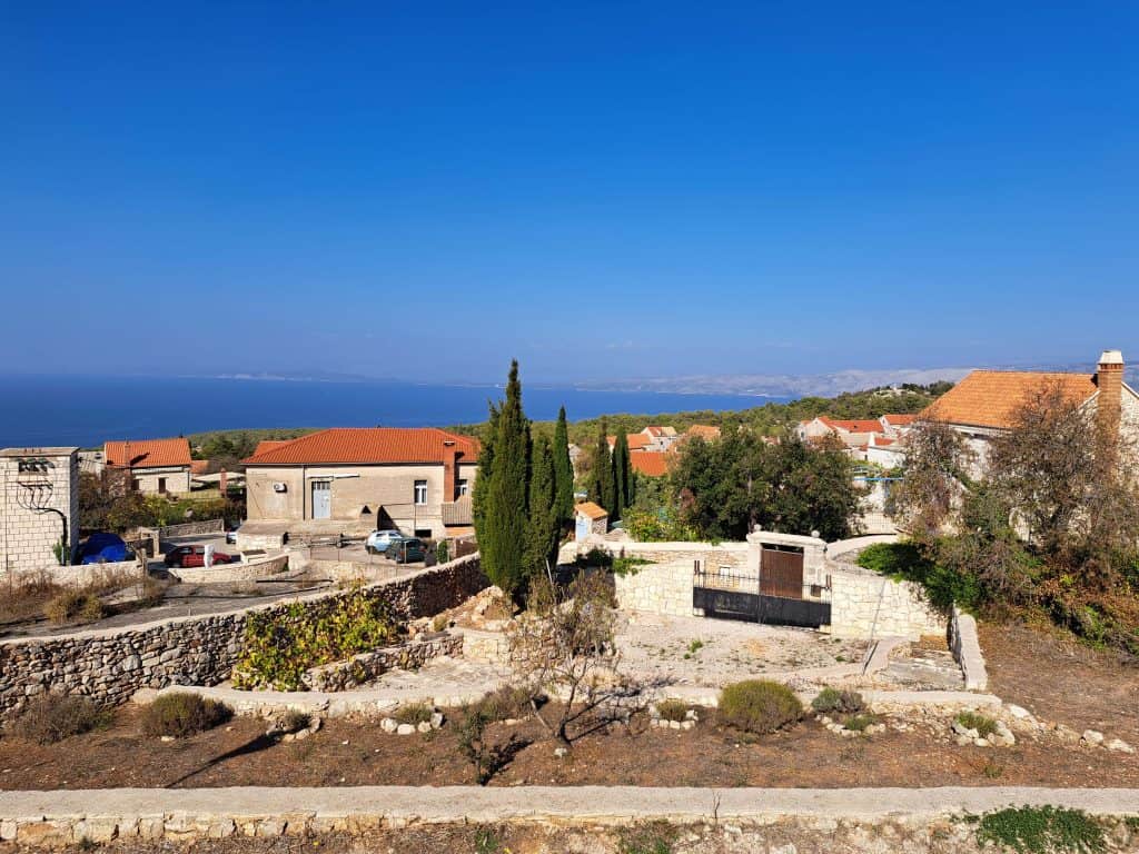 View from Brusje over the village rooftops toward the sea