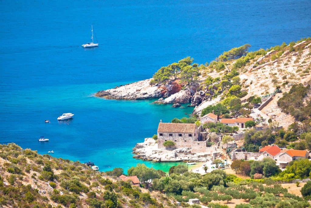 Turquoise water and moored boats in Dubovica bay