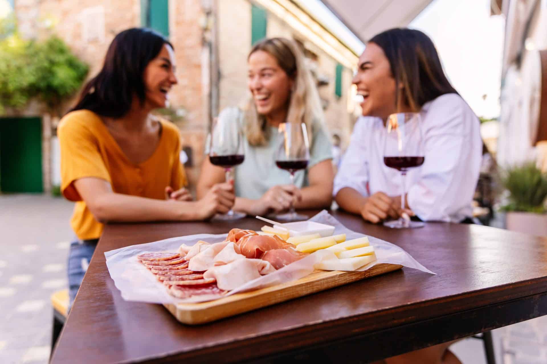 Friends wine tasting outdoors