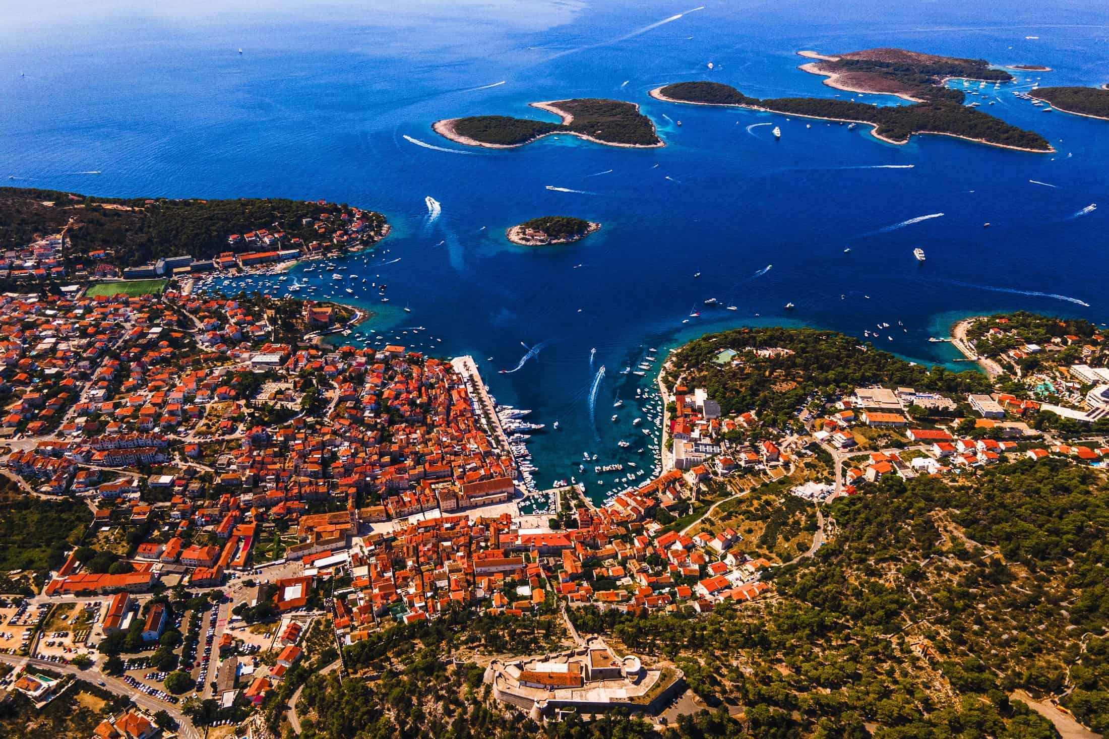 Hvar Town from the air: the harbour, the old town roofs and the Pakleni islands beyond