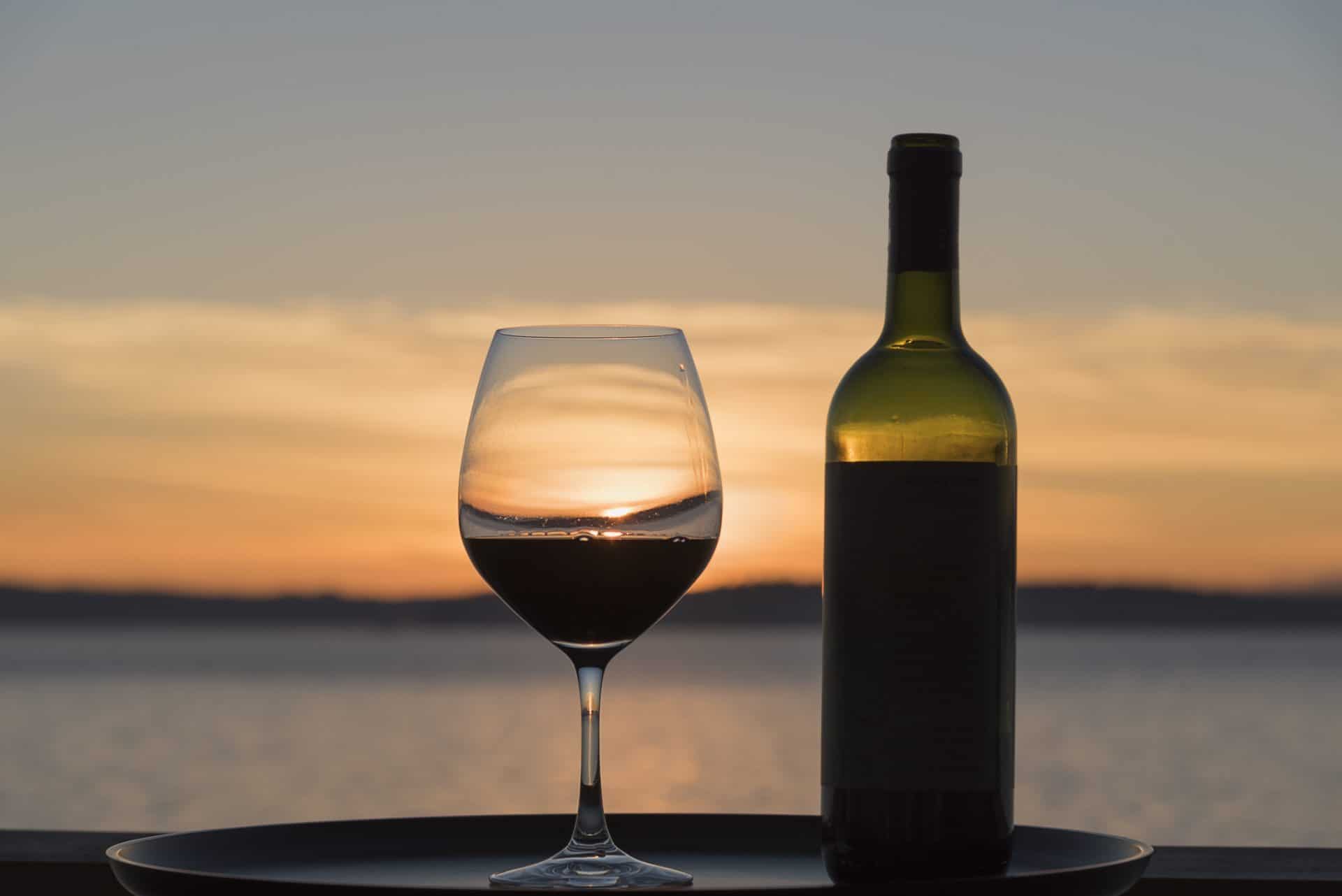Red wine bottle glass sunset sea