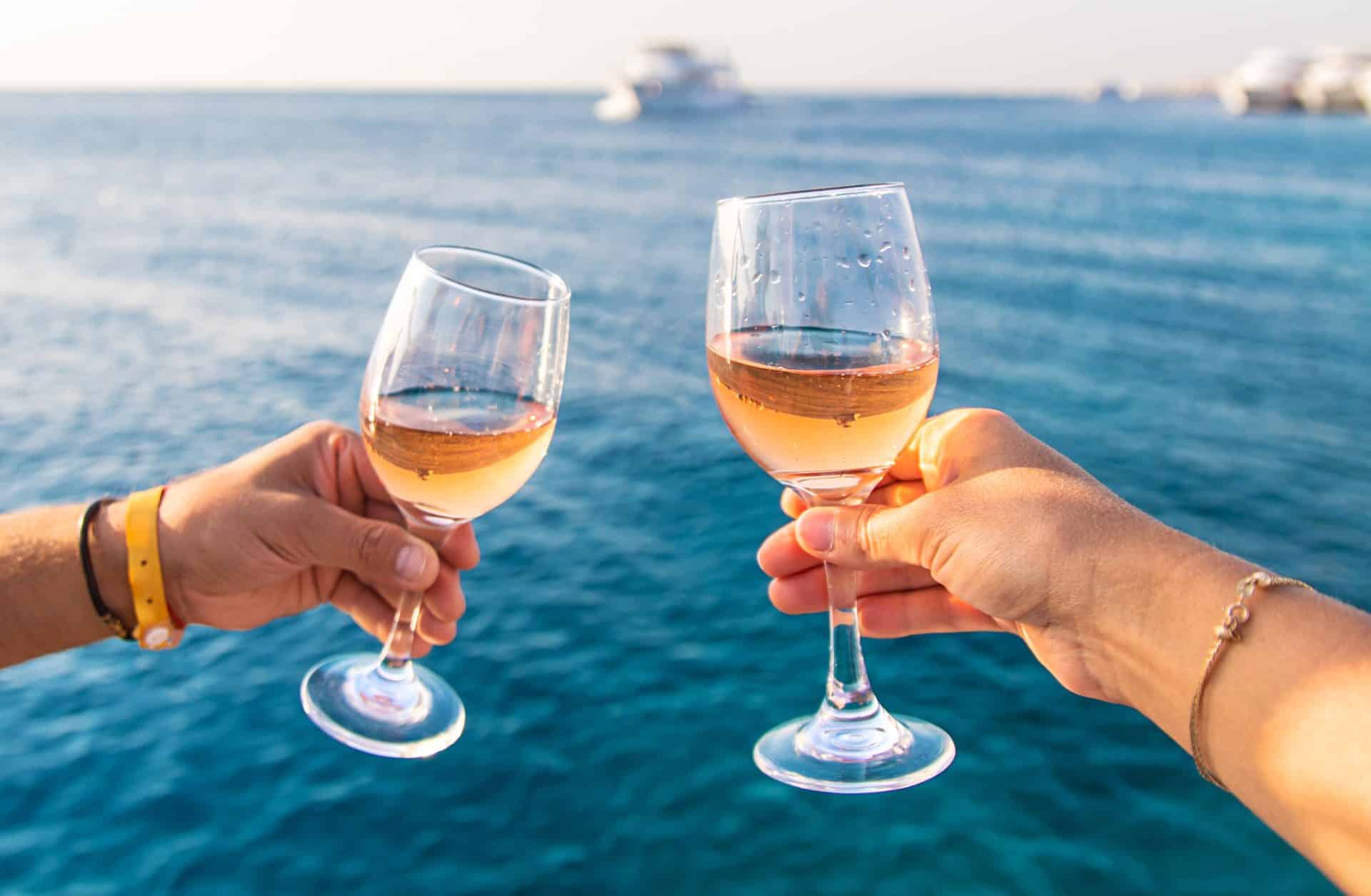 Rosé wine toast over sea