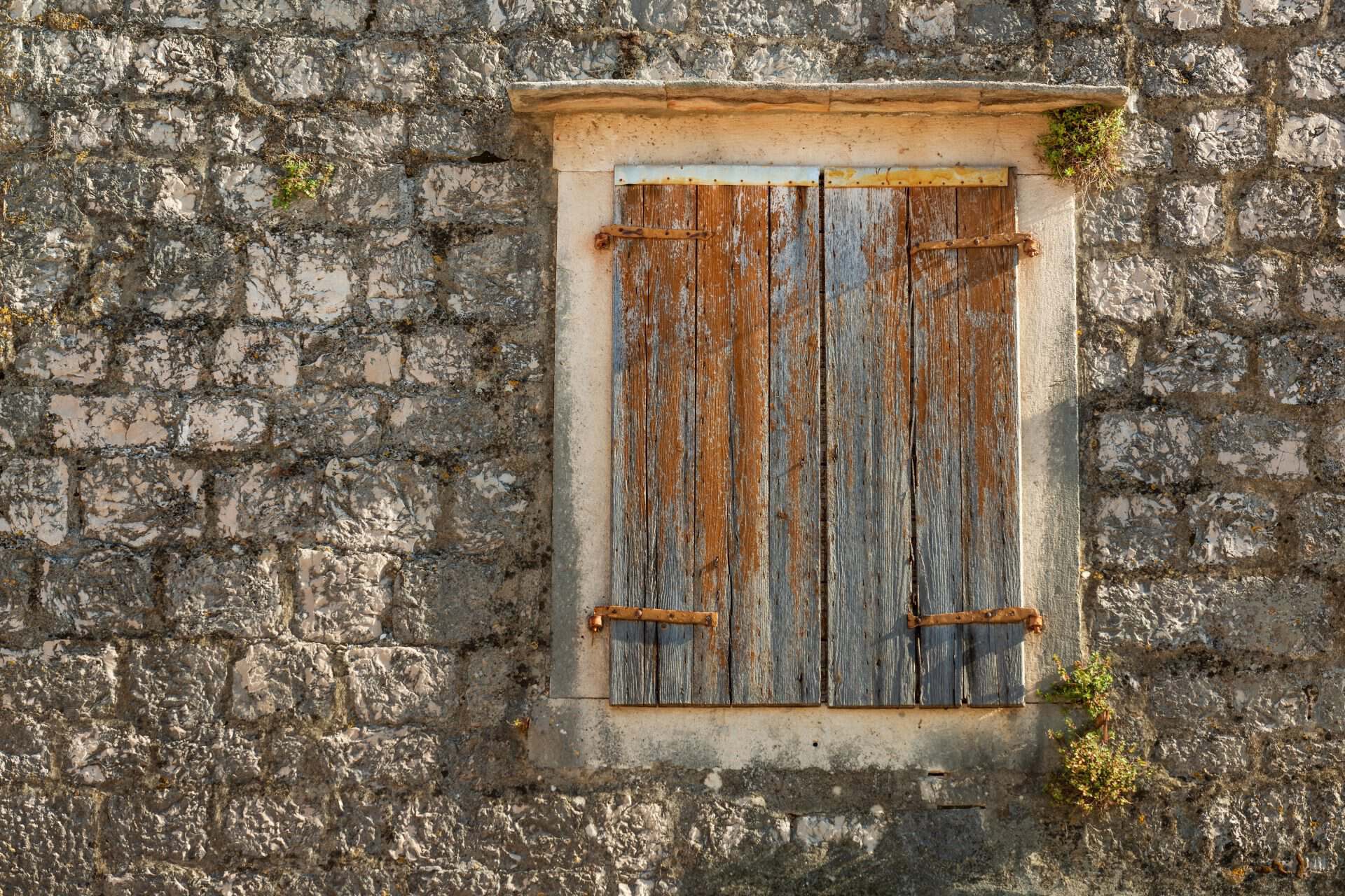 Stone house window shutters