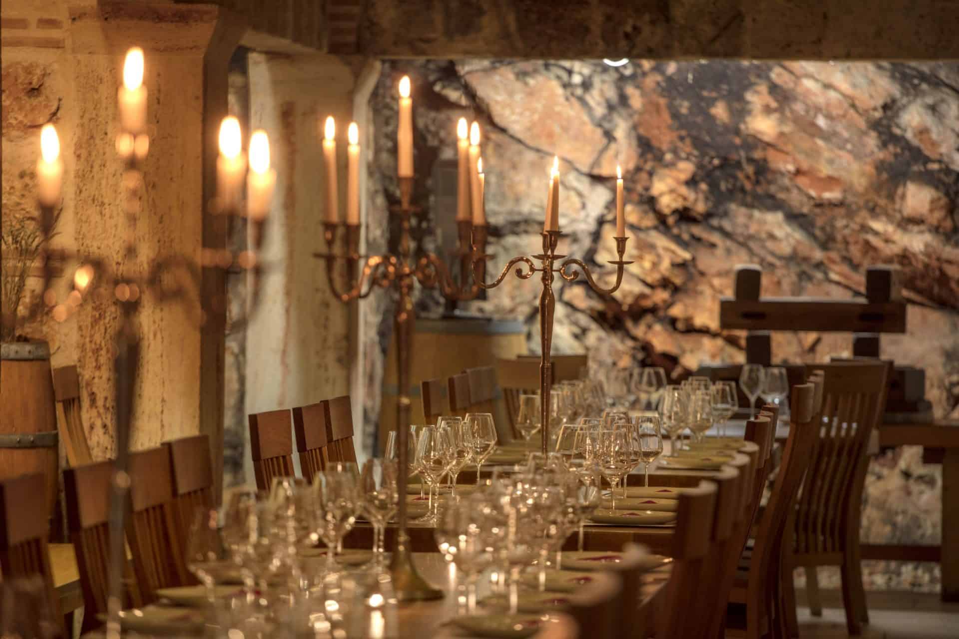 Candlelit tables in the Tomić Triclinium