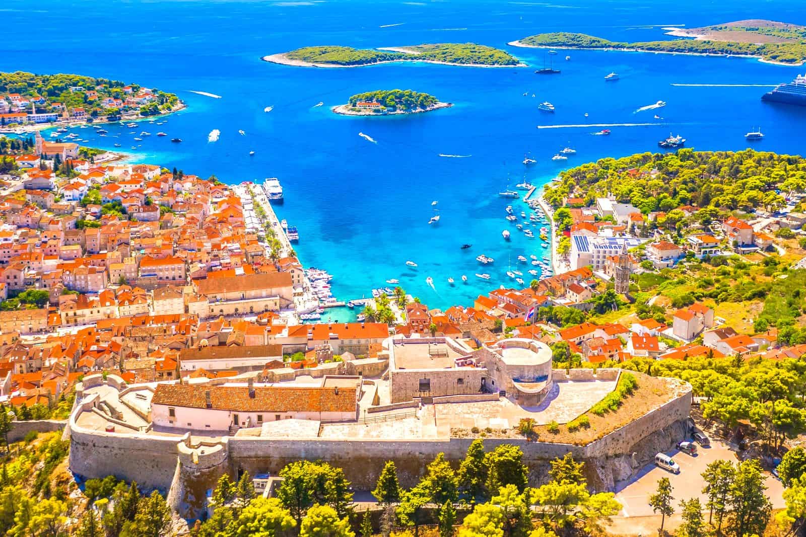 The whole Fortica fortress above Hvar Town seen from above, with the old town, the harbour and the Pakleni Islands behind it