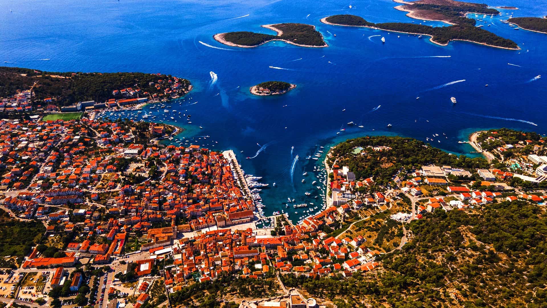 Aerial view of Hvar Town, its harbour and the Pakleni Islands lying in front of it